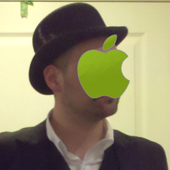 Jonathan wearing a hat with apple logo covering his face