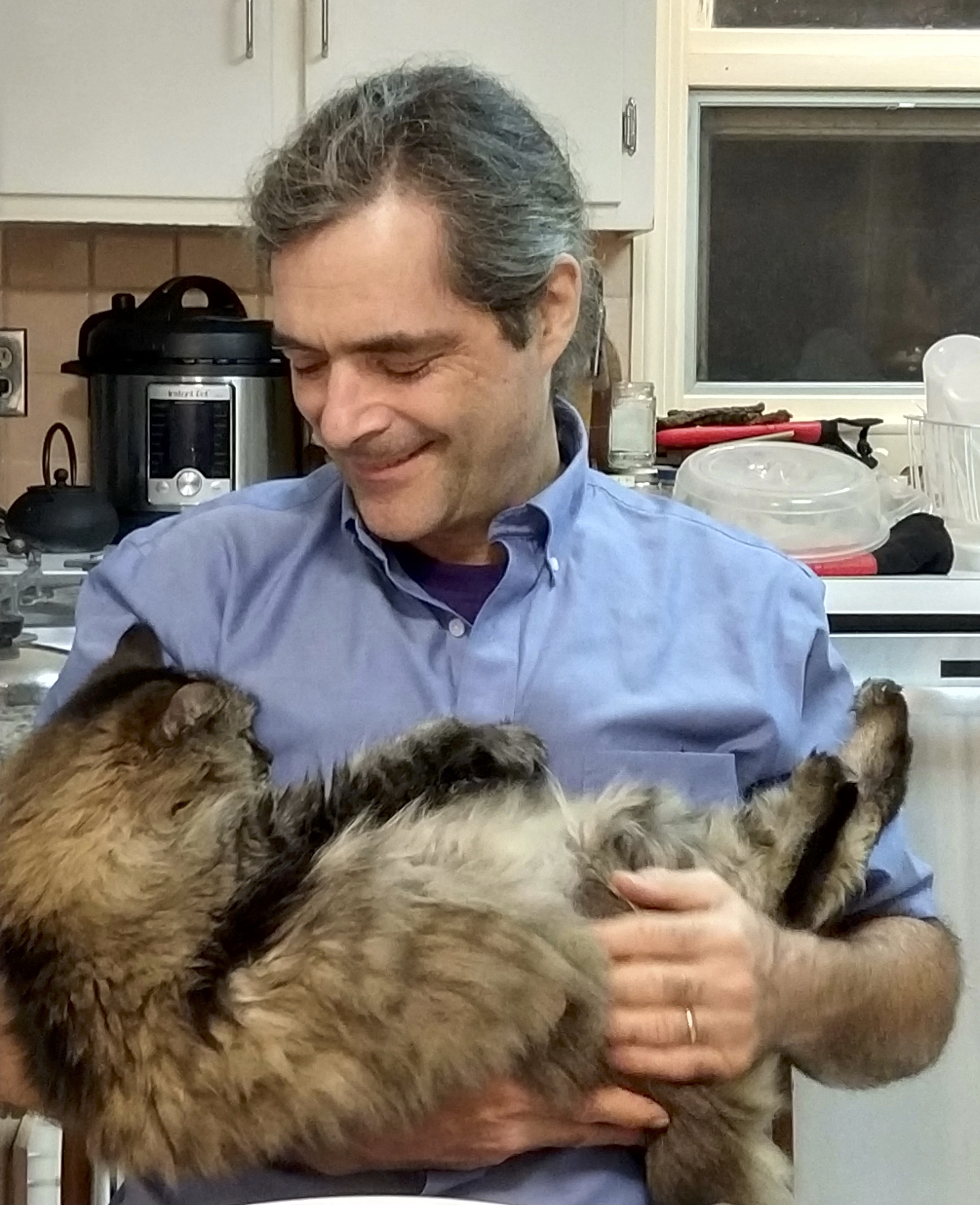 benji holding his pet cat