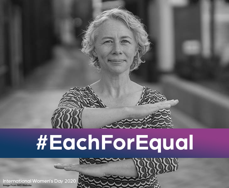 Older woman showing equal symbol with arms with hashtag Each For Equal, image from IWD website, graphic made by hook 42