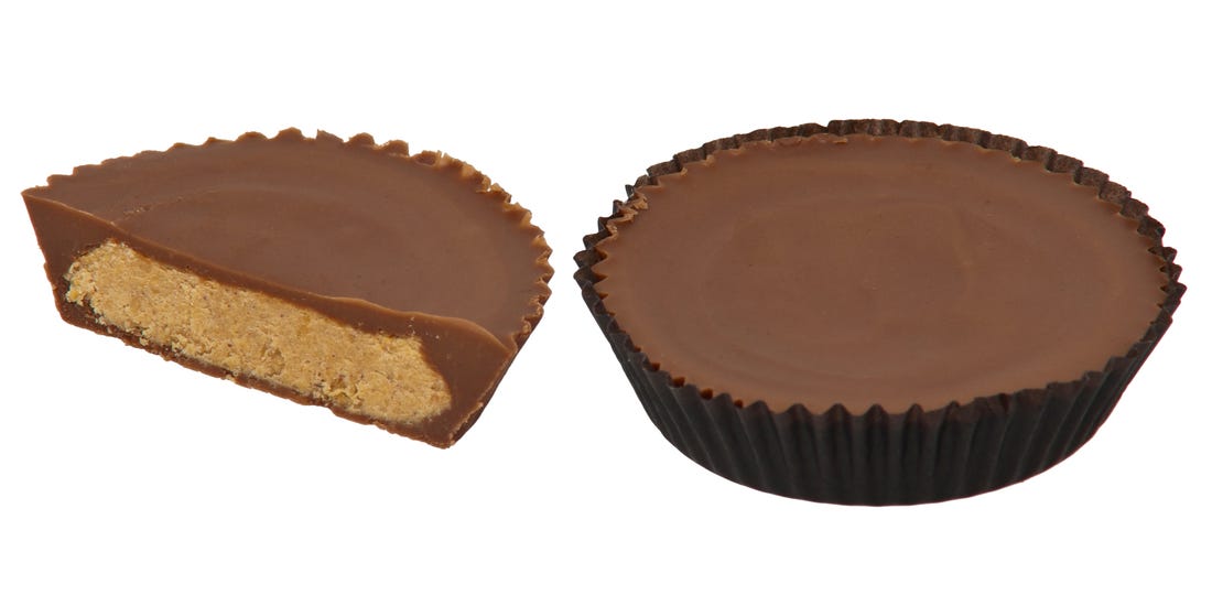 Wrapped and unwrapped half-eaten reeses cup side by side