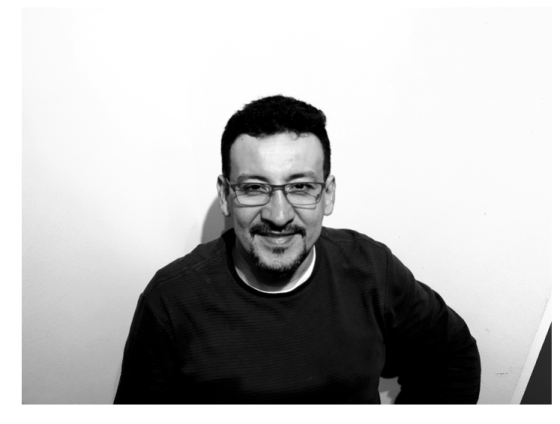 Black and white visual of Eduardo Garcia smiling