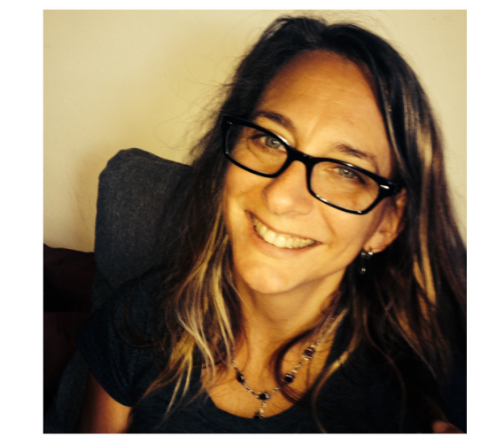 Jill Cohen smiling from her desk