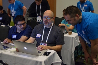 Dan helping a sprinter at DrupalCon Nashville First Time Sprinter Workshop