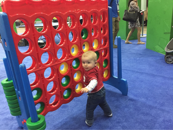 Ryan Maxwell at the Four Kitchens booth playing Connect Four