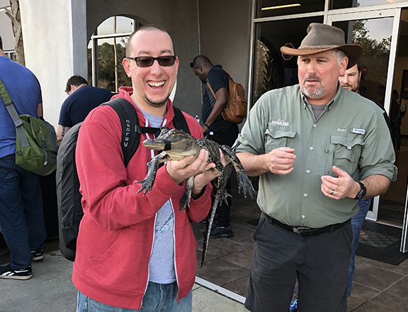 Adam holding an alligator